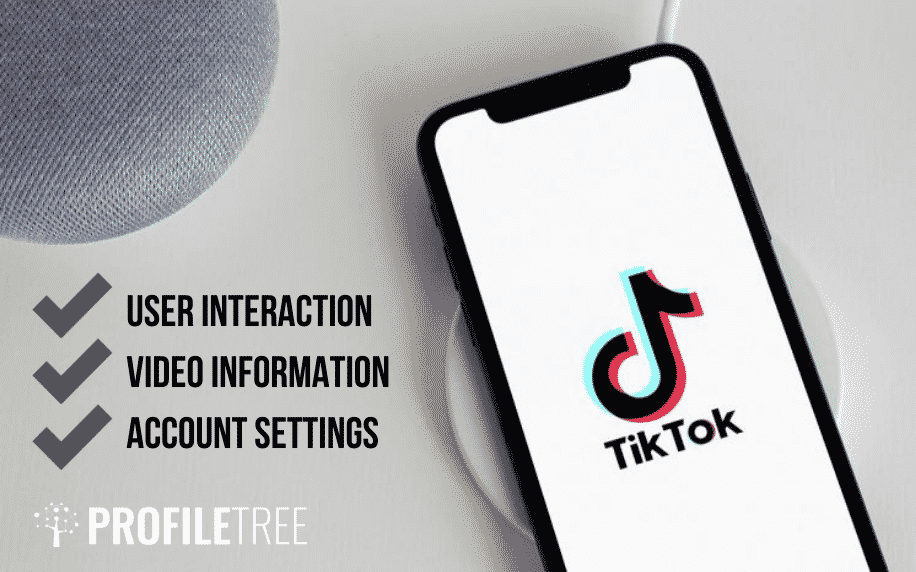 fond gris avec téléphone noir avec icône tiktok à l'écran